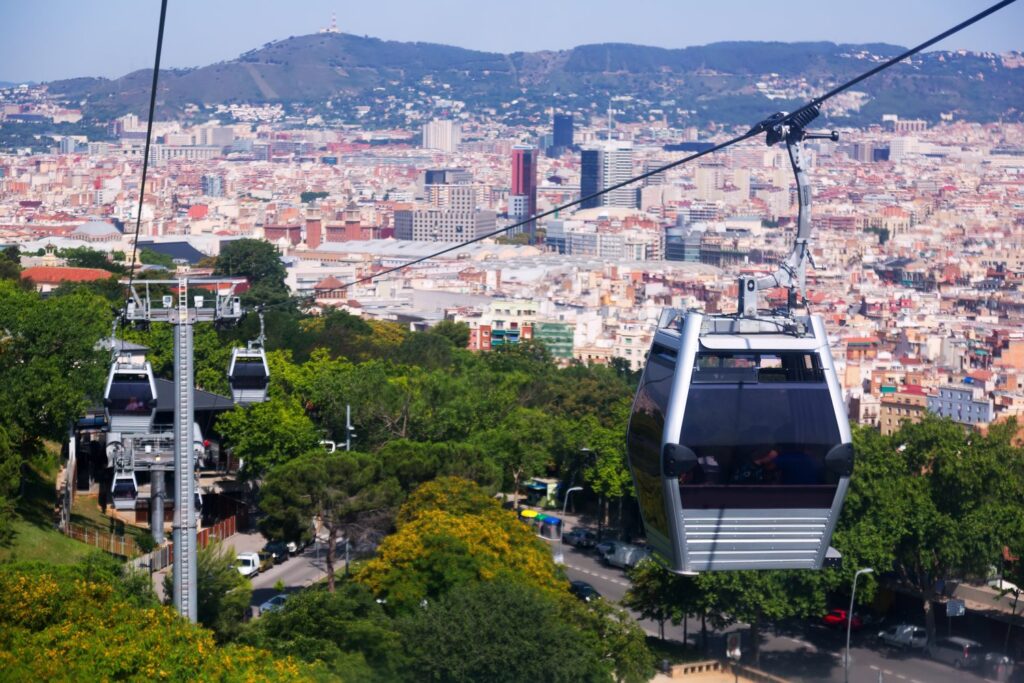 The Montjuïc cable car carries up to eight people per cabin over the pine trees of Montjuïc