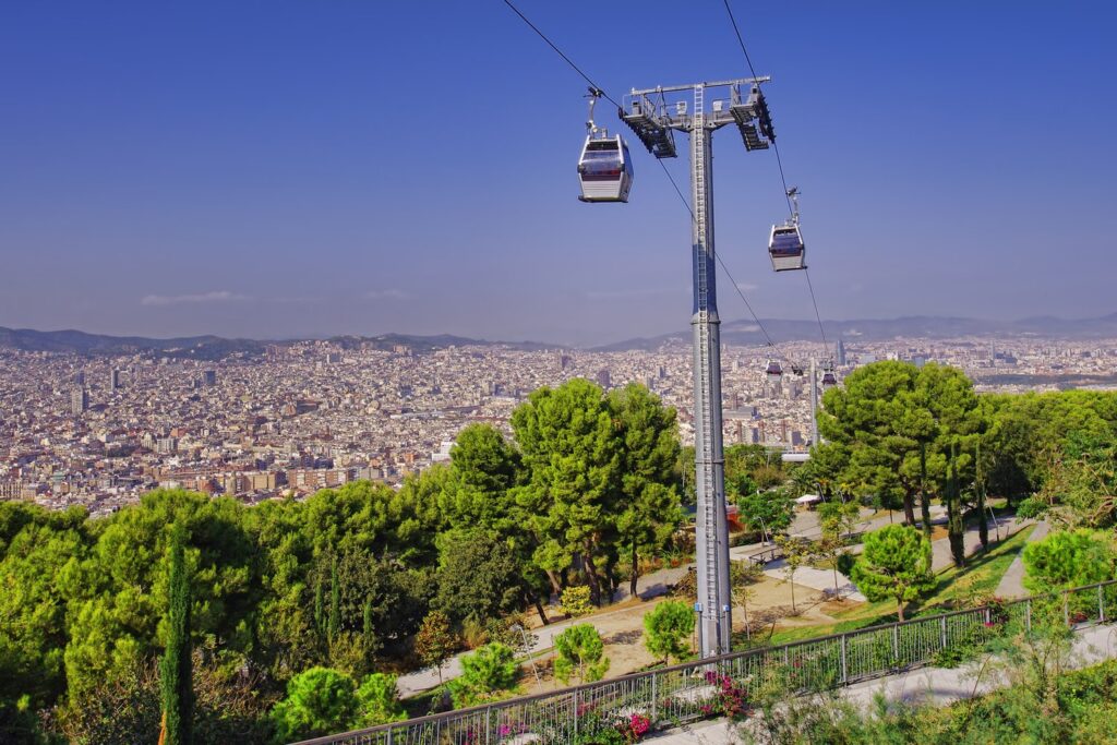 The cable car line climbs from Parc de Montjuïc towards the castle above the gardens