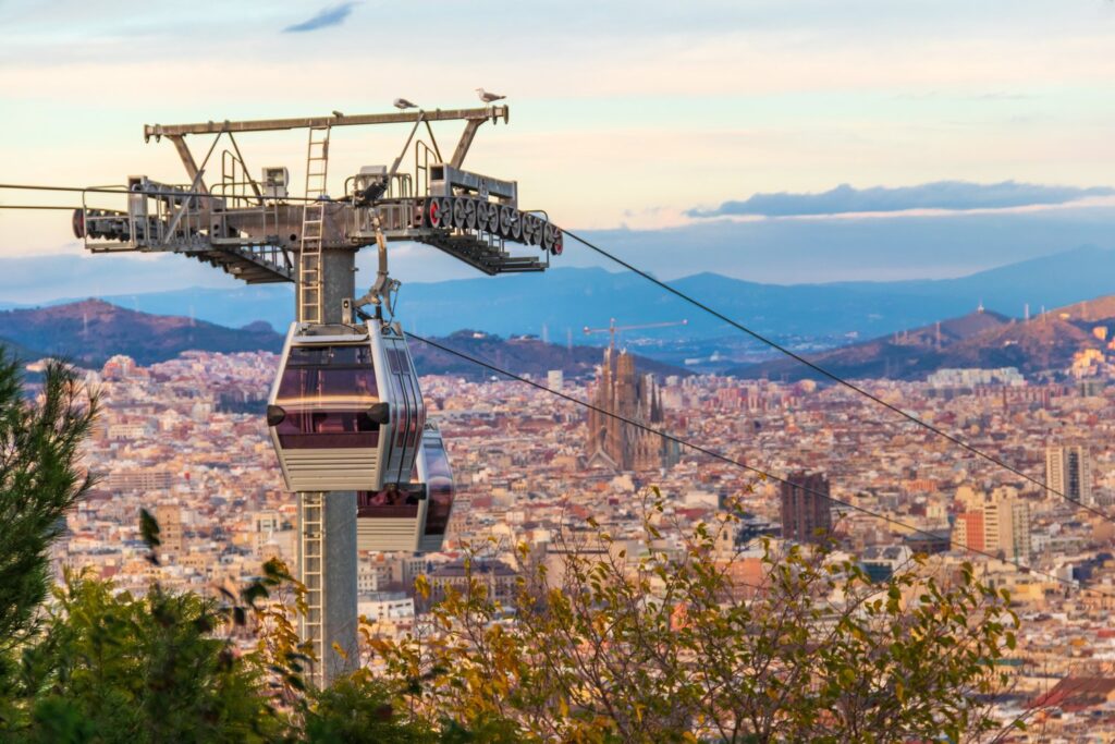 At sunset you can spot the Sagrada Familia behind the cable car towers on Montjuïc