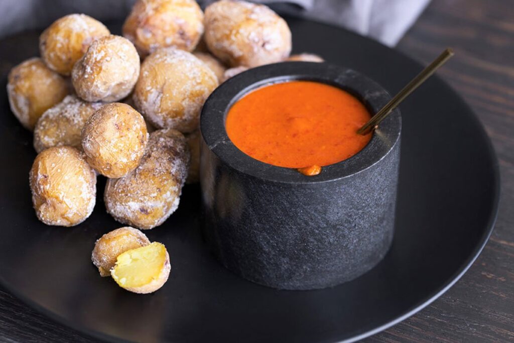 Papas arrugadas with red and green mojo sauce are a must-try Canarian dish