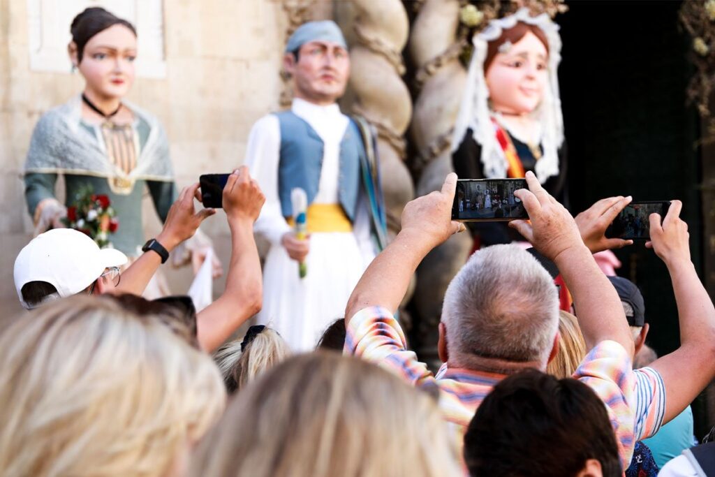 Crowds fill the streets of Alicante during the Hogueras de San Juan in June.