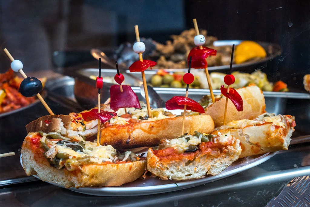 A plate of delicious Granada-style cuisine, showcasing the unique flavors and ingredients of Granada