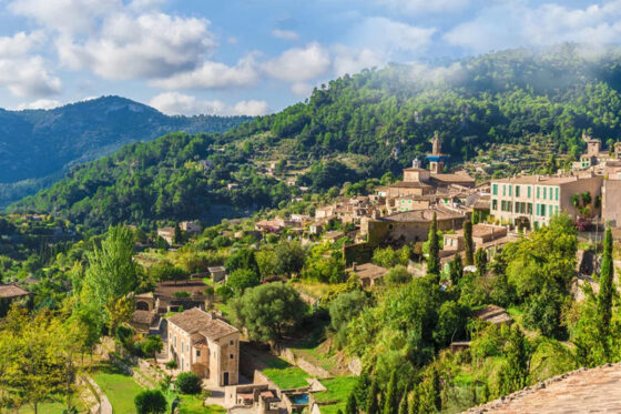 A stunning view of the charming village of Valldemossa nestled in the Sierra de Tramuntana mountain range