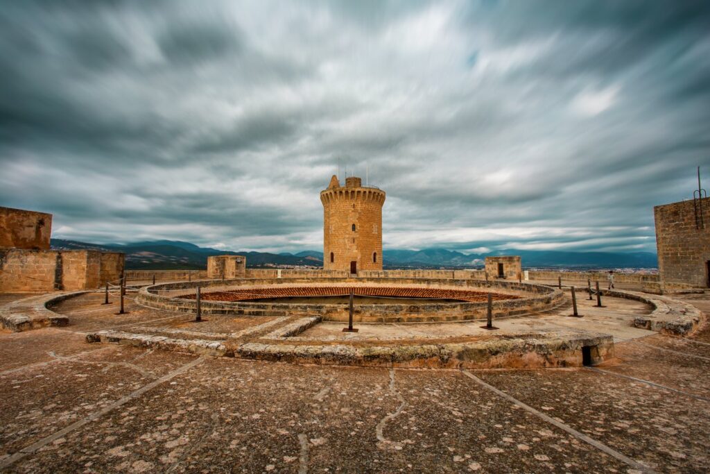 The rooftop terrace of Bellver Castle looks across the moat to the detached keep