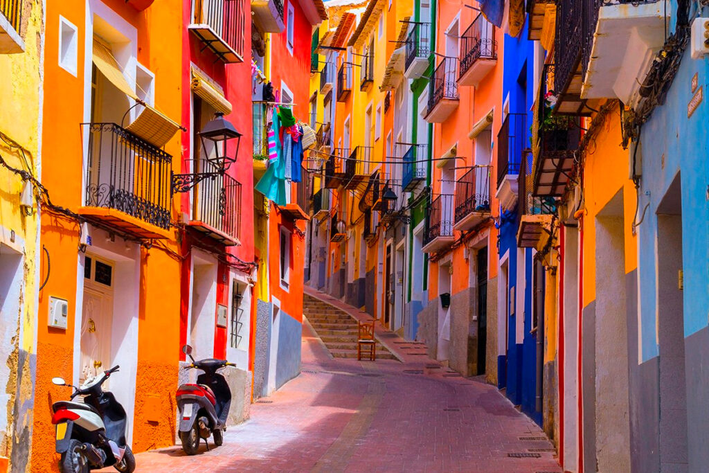 Narrow streets with balconies and colourful façades in the old town of Villajoyosa