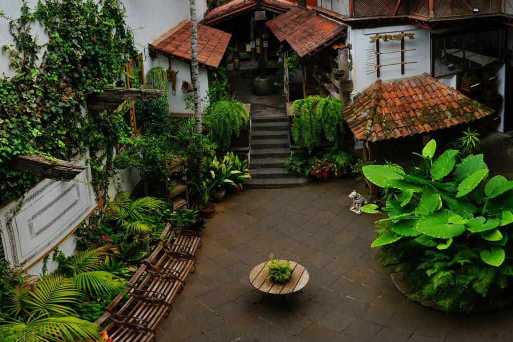 The green inner courtyard of the Casa de los Balcones with its wooden galleries