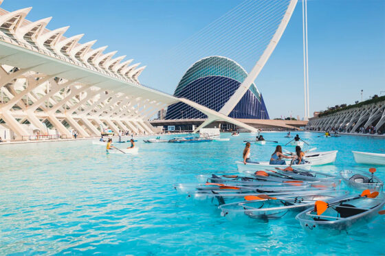 A view of the modern transparent boats on the water in Valencia's City of Arts and Sciences