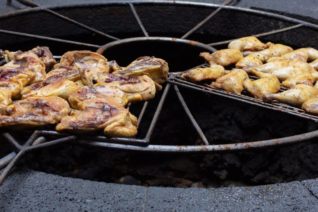 Chicken cooks over the volcanic heat on the grill of the El Diablo restaurant