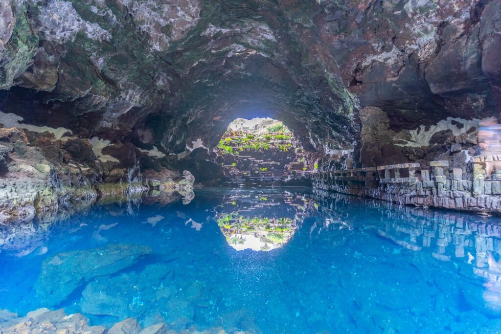 Daylight falls into the lava tube of Jameos del Agua and its saltwater lagoon