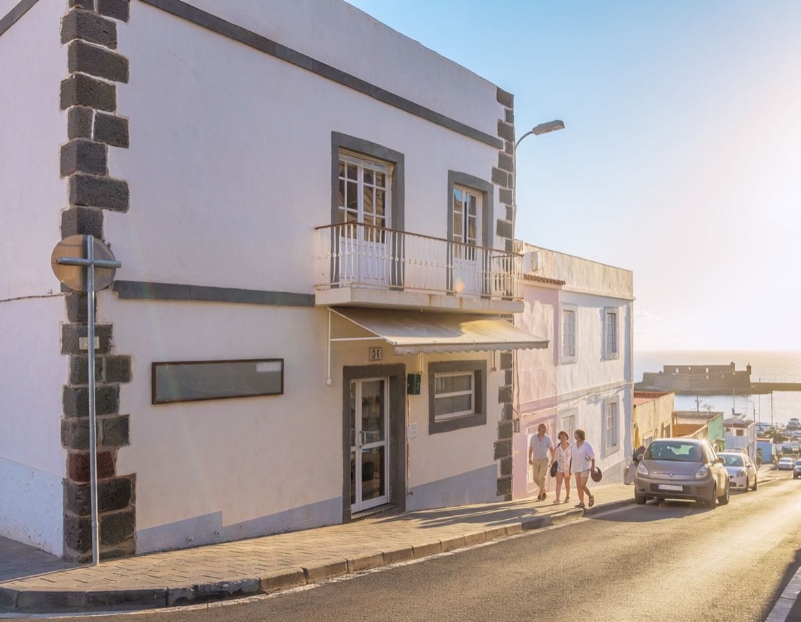 Hostal Residencia Cardona is a simple guesthouse by the sea in Arrieta. AI-generated image.