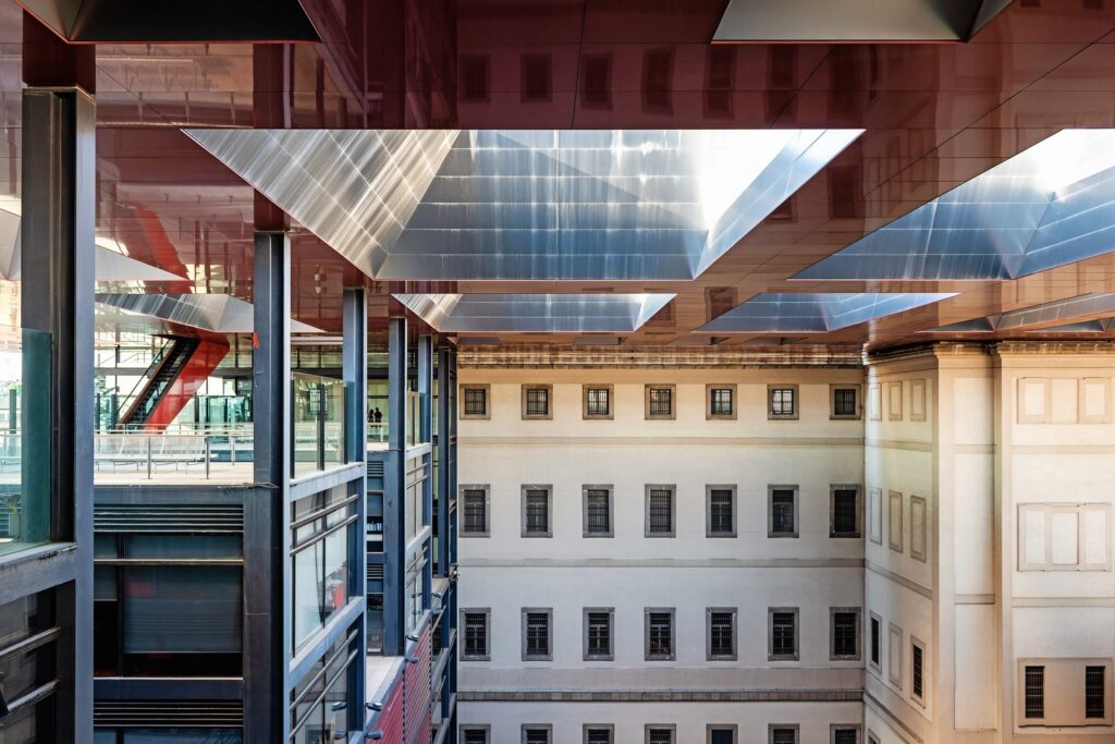 The Reina Sofía Museum, home to Picasso's Guernica, combines a former hospital with modern glass extensions.