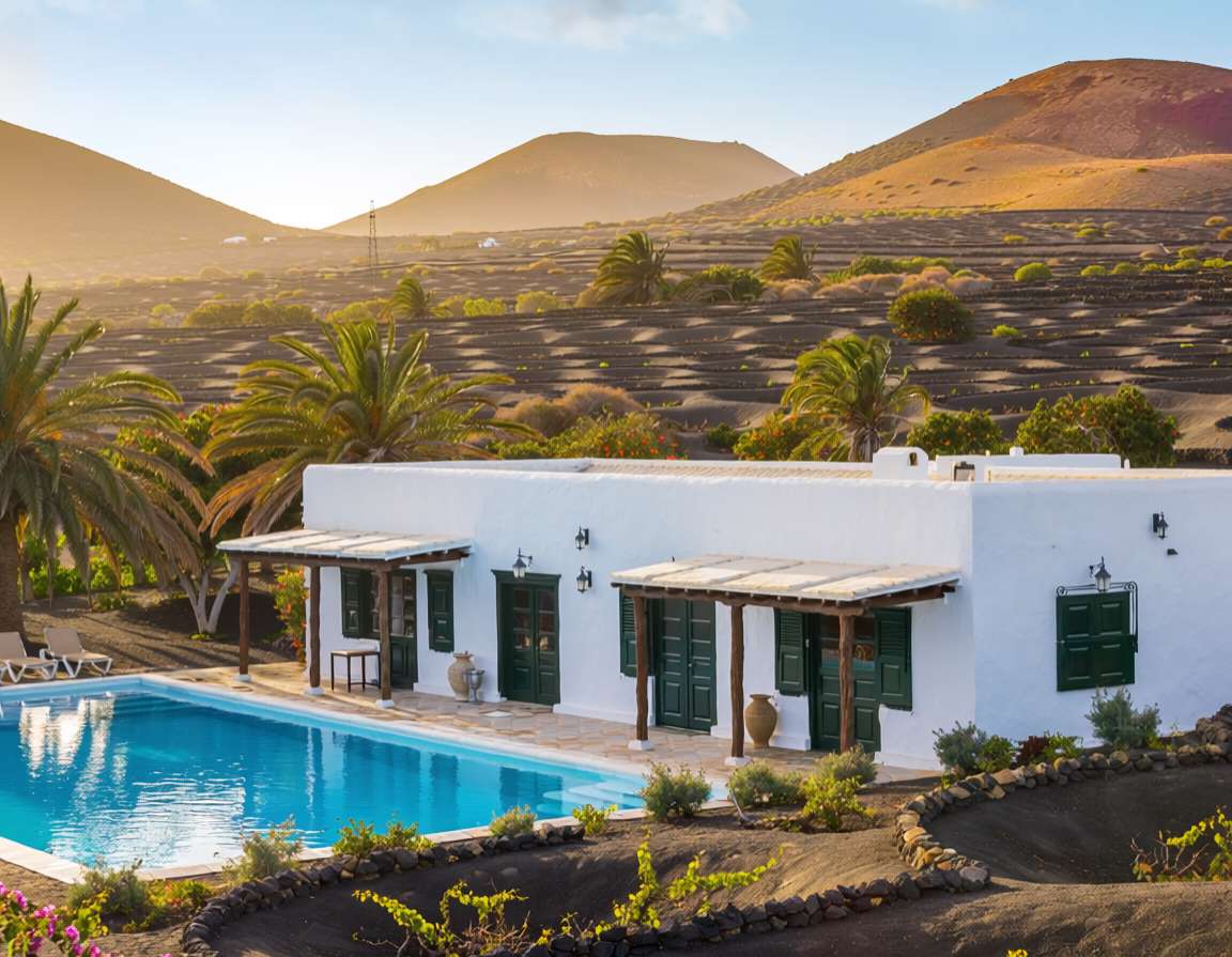 Hotel Rural Finca de La Florida is a country hotel among the vineyards of central Lanzarote. AI-generated image.